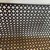 1950s black perforated metal planter in the style of Mathieu MATEGOT