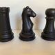 Trio of chess game candlesticks, rook, knight, pawn
