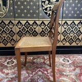 Suite de 9 chaises en cannage de style Empire - Consulat