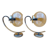 Pair of chrome metal wall lights with glass globe