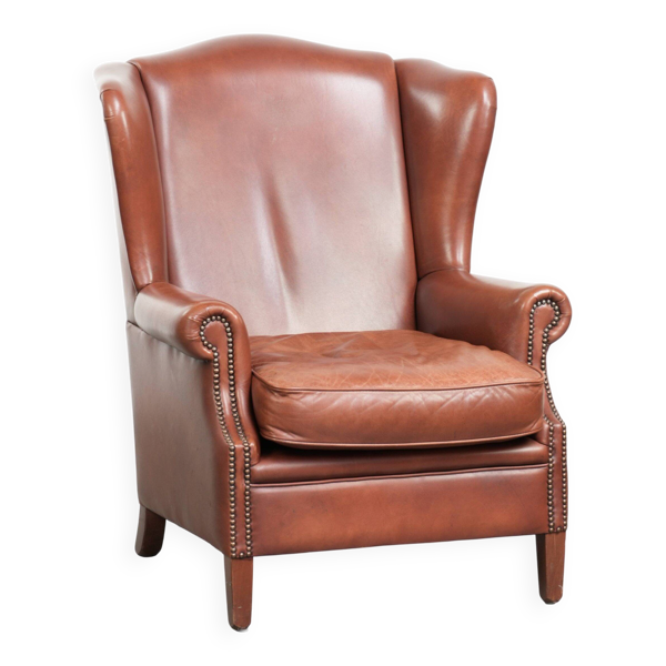Fauteuil à oreilles en cuir de vache couleur cognac de style anglais