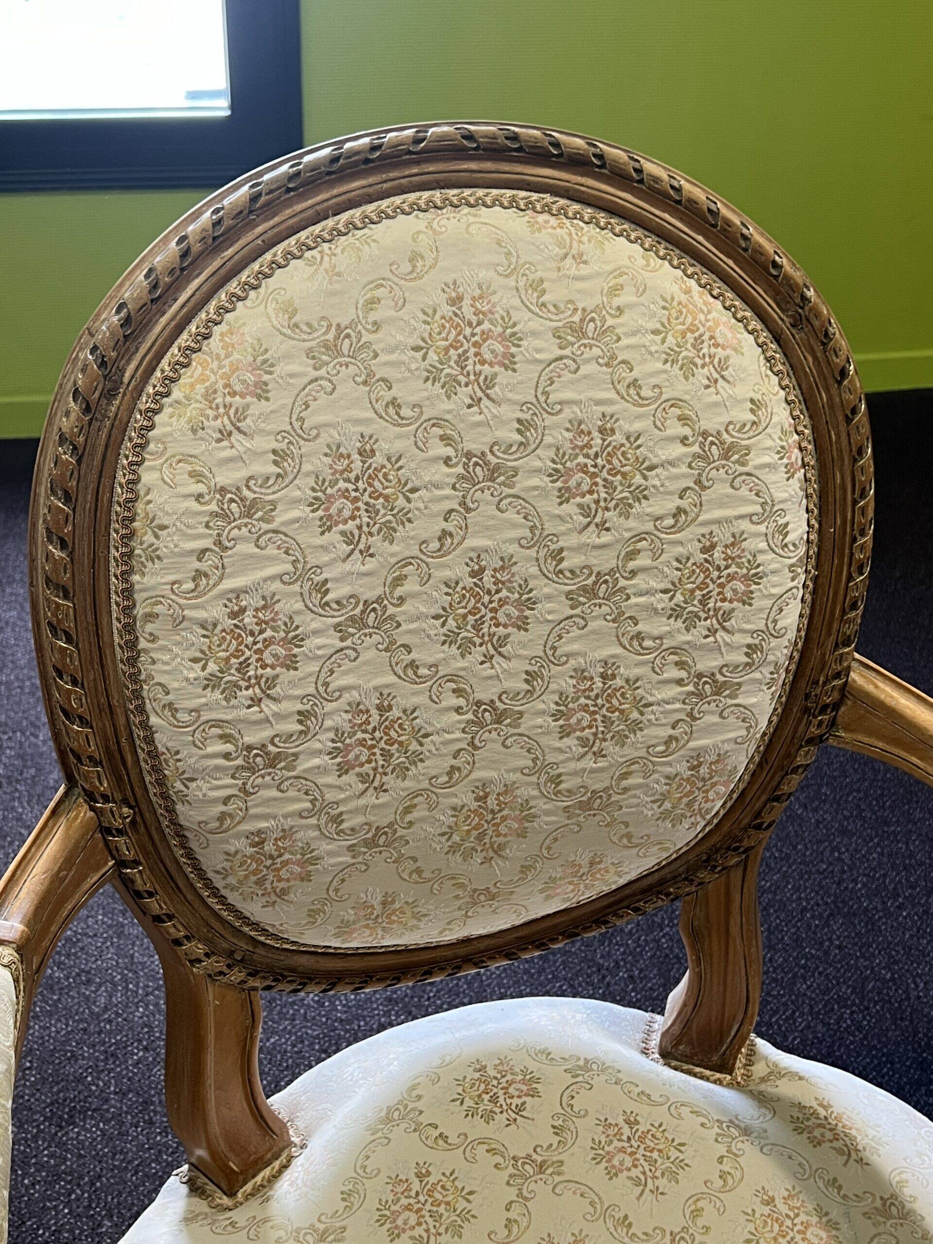 Pair of Louis XVI style armchairs, in solid walnut, re-edged and upholstered, pegged