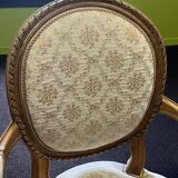 Pair of Louis XVI style armchairs, in solid walnut, re-edged and upholstered, pegged