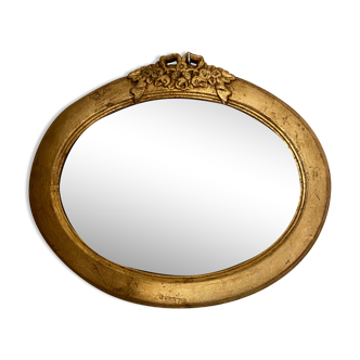 Oval mirror in gilded wood with knot, 32x37 cm