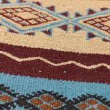 Multicolored hand-woven Berber rugs in natural wool