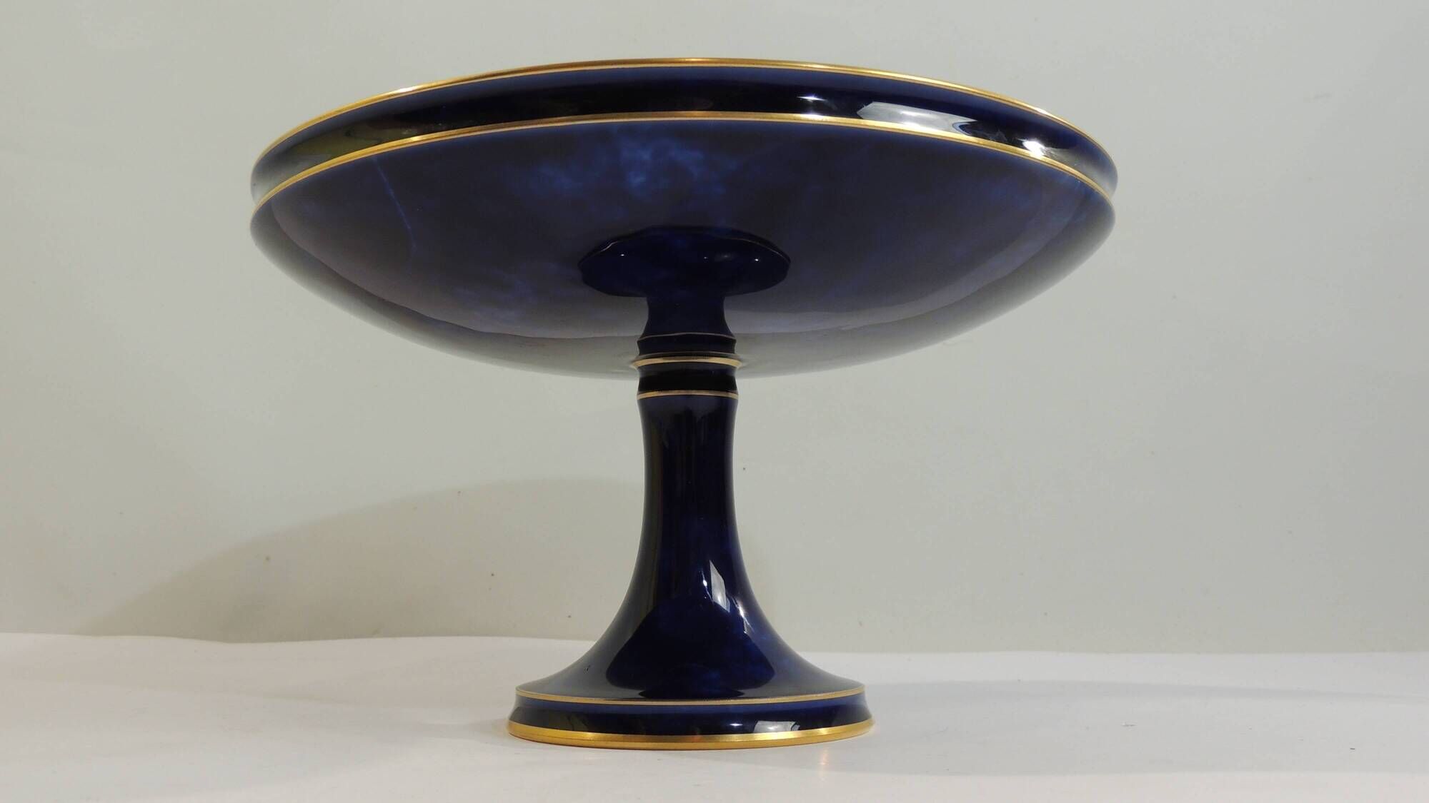 Sèvres porcelain cobalt blue footed bowl with gold rim – center