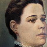 Oil on canvas portrait in an antique gilded wooden frame.