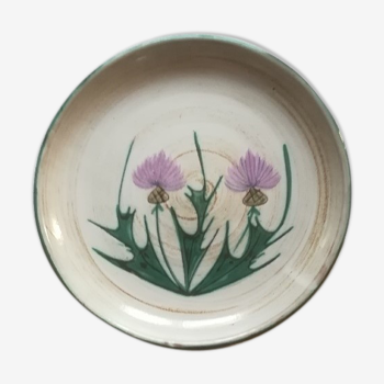 Round dish with thistles