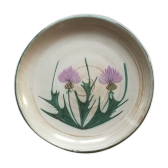 Round dish with thistles