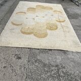 Large rug with flower decoration.