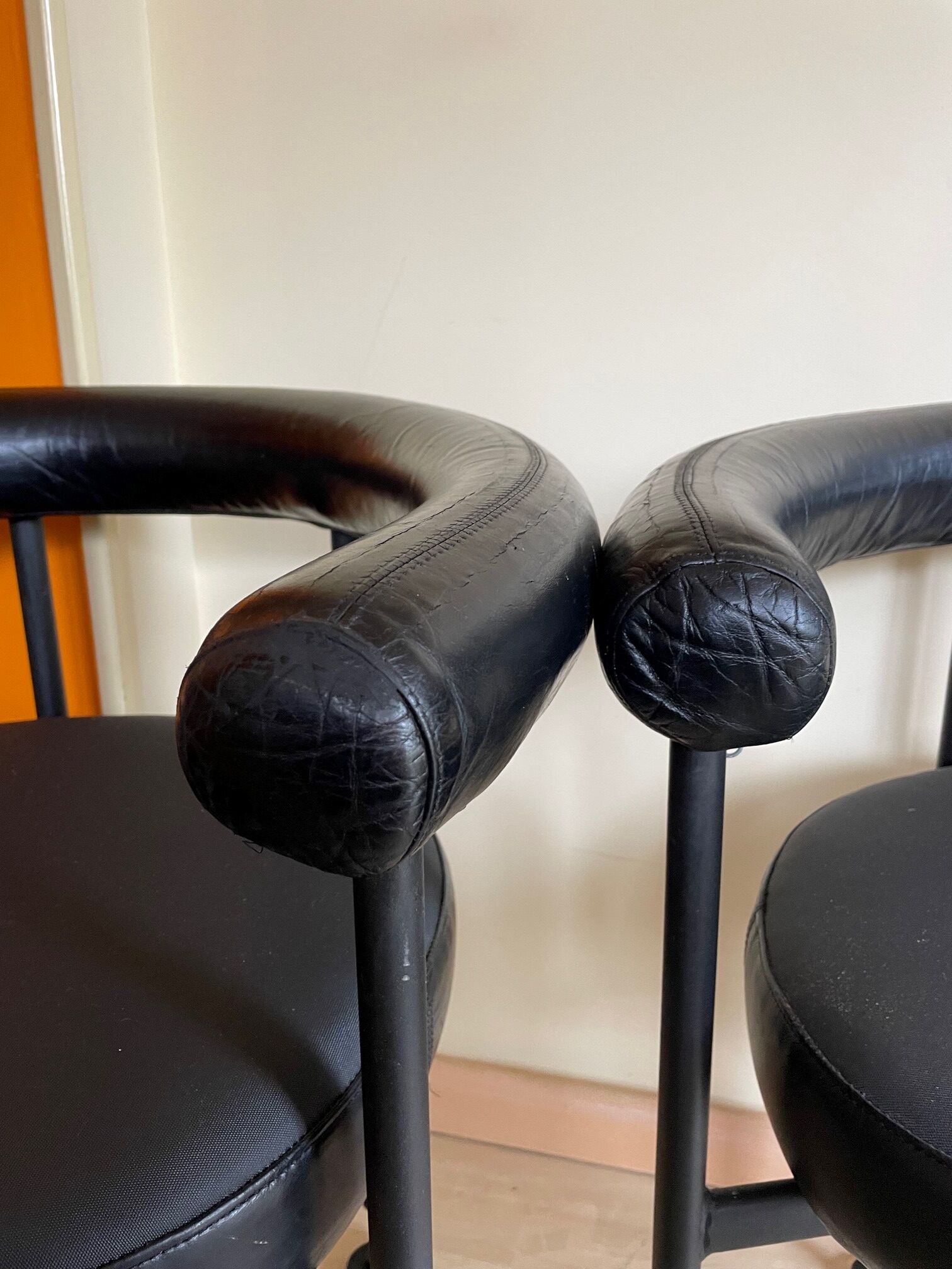 Pair of vintage leather basket armchairs
