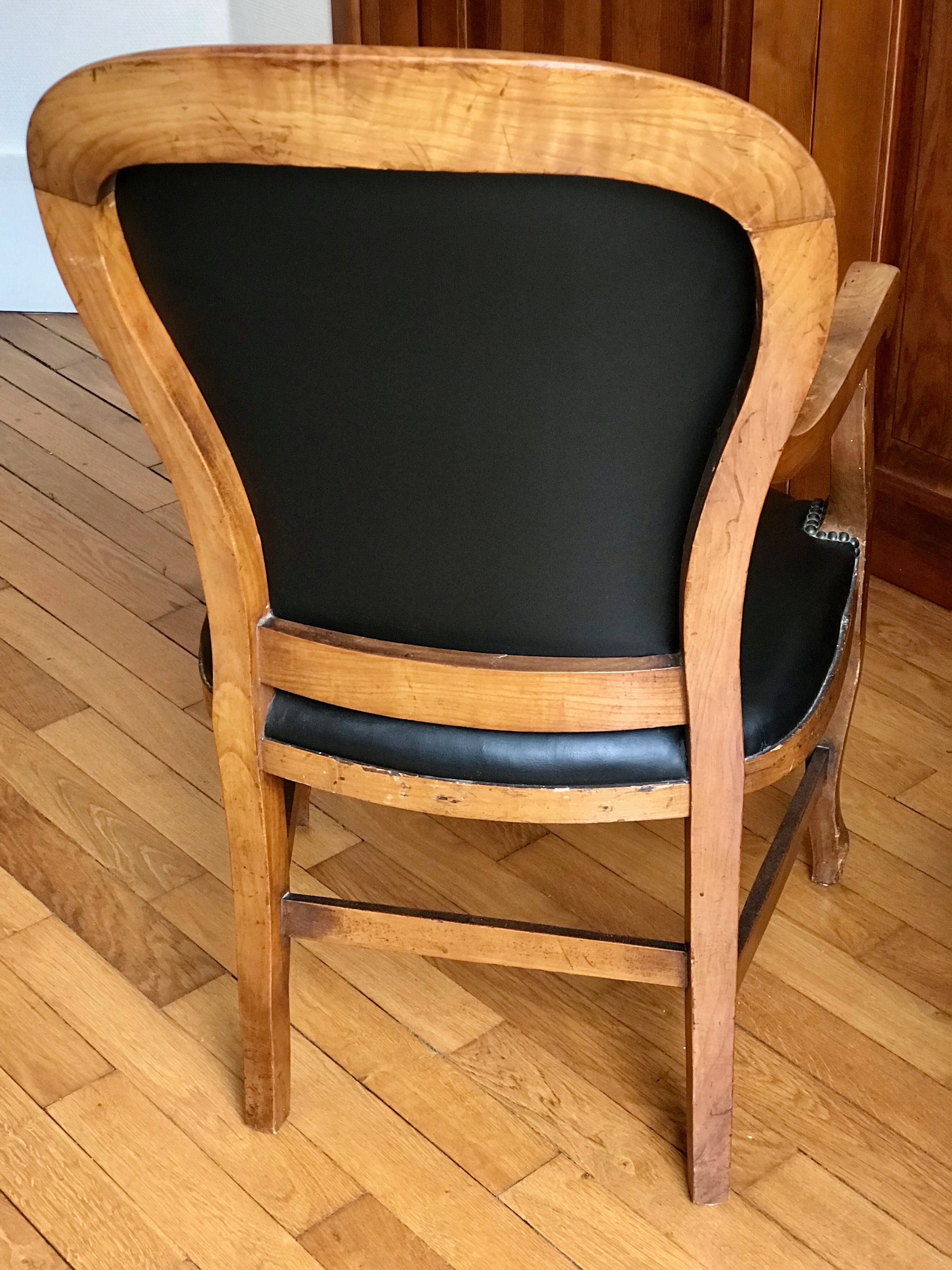 Wood and leather armchair