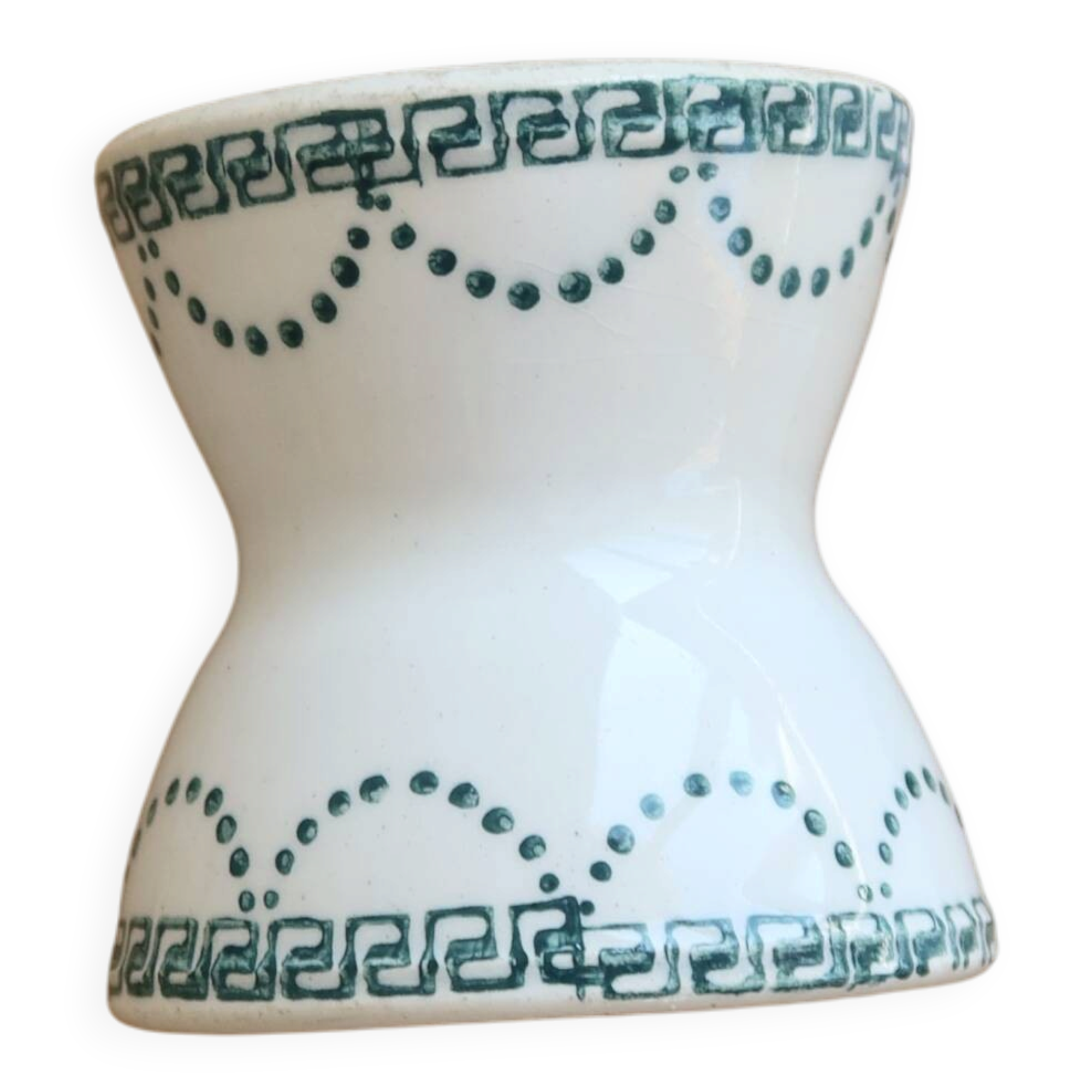 Old diabolo egg cup, ironstone with ivory and green pattern.