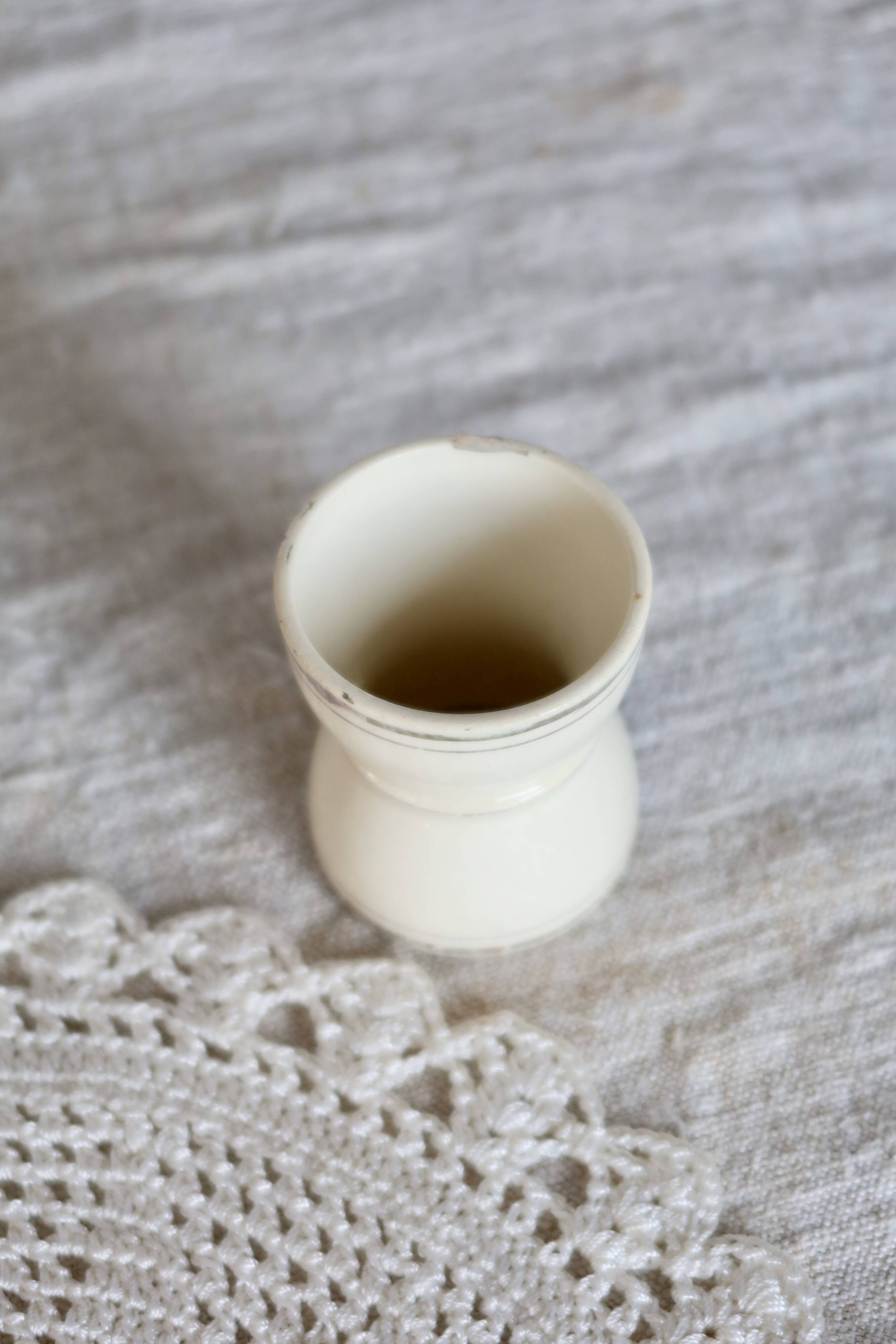 Antique egg cup, ironstone diabolo, ivory and gold edging