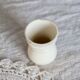 Antique egg cup, ironstone diabolo, ivory and gold edging