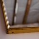 Metal and brass framed mirror