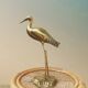 Heron in brass
