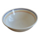 Vintage porcelain salad bowl with multicoloured borders.