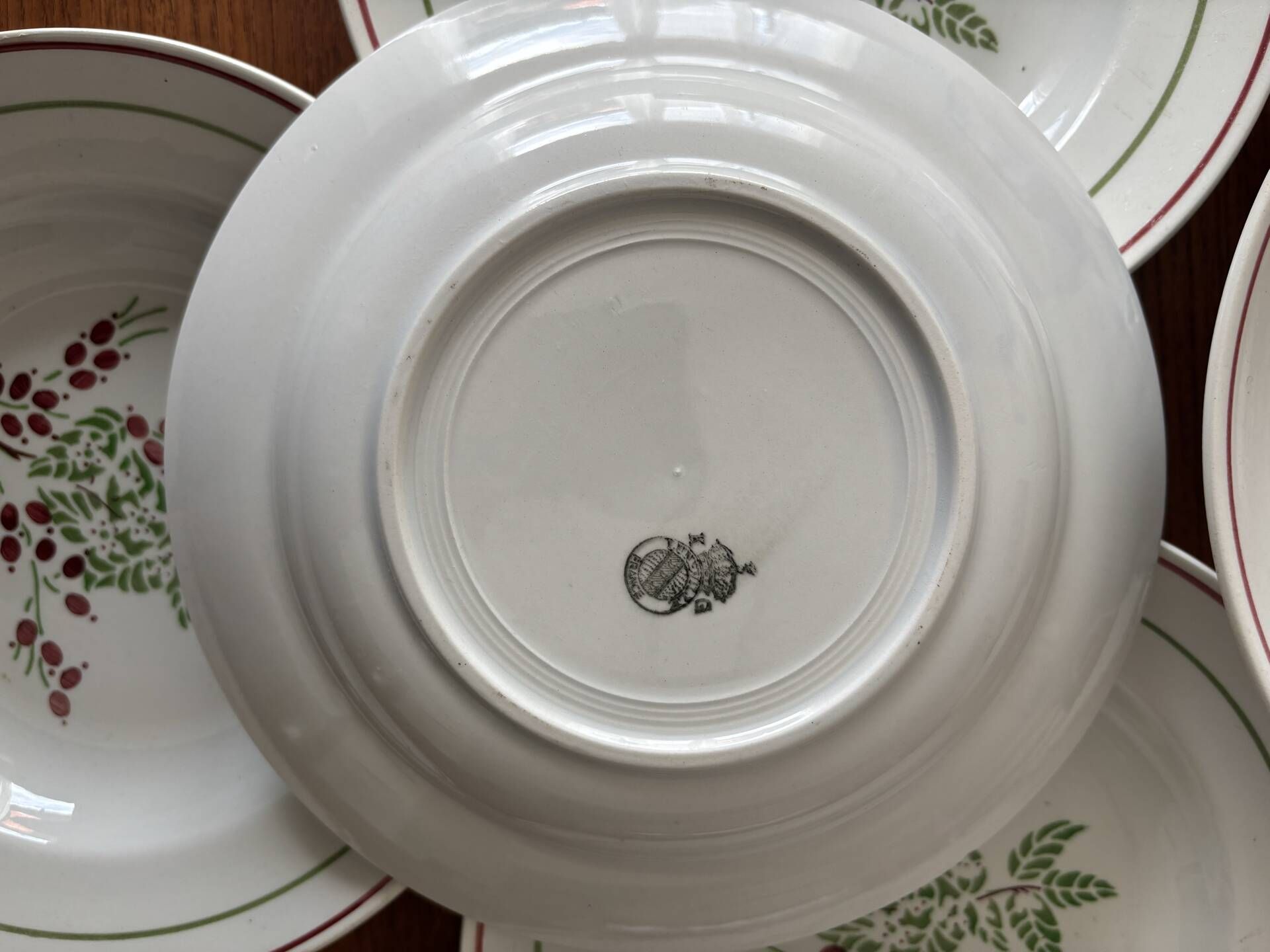 Set of 8 antique deep plates KG Lunéville, floral berry decoration.
