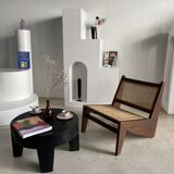 Reclined armchair in canned teak in natural wood