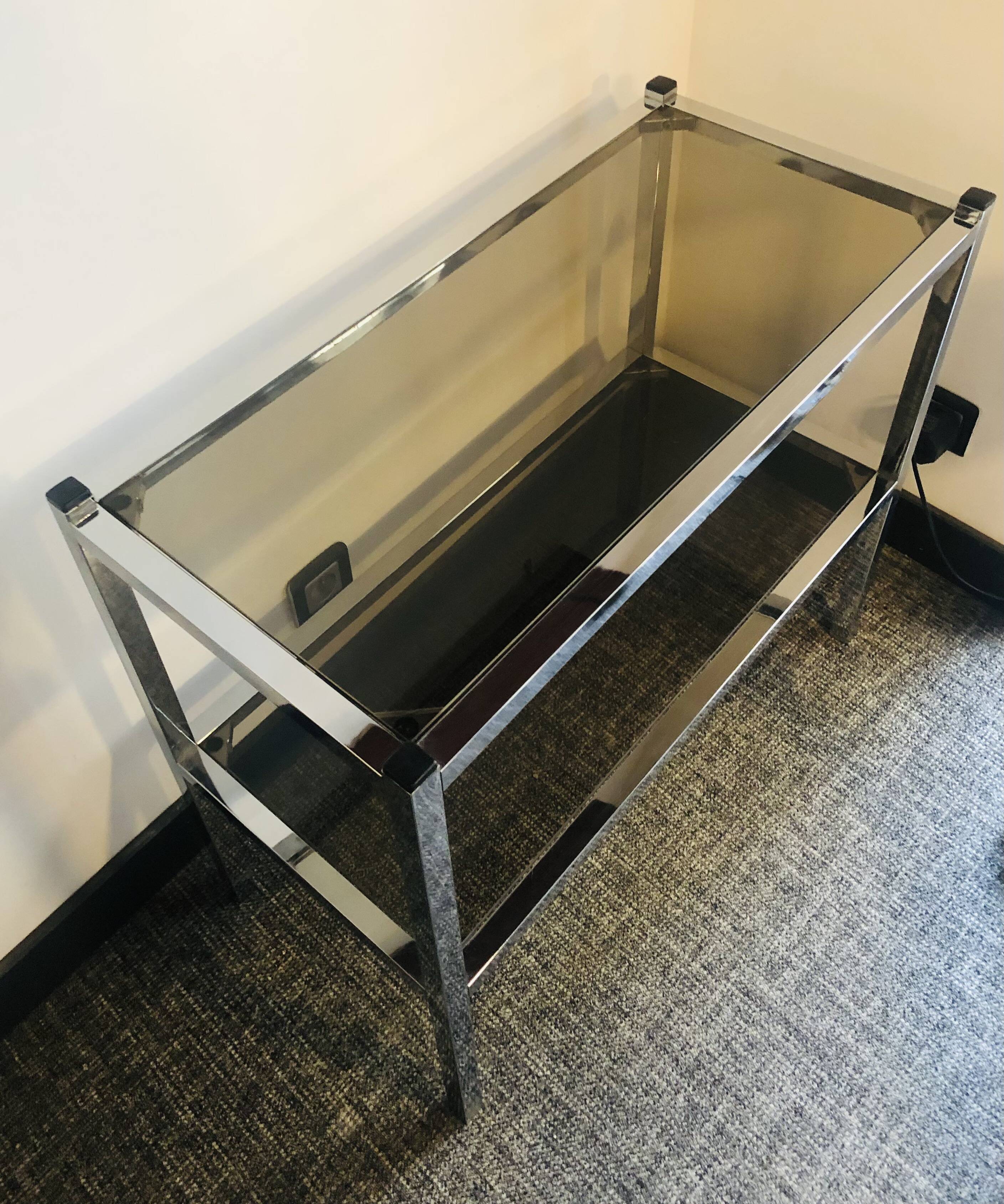 Chrome console and tinted glass