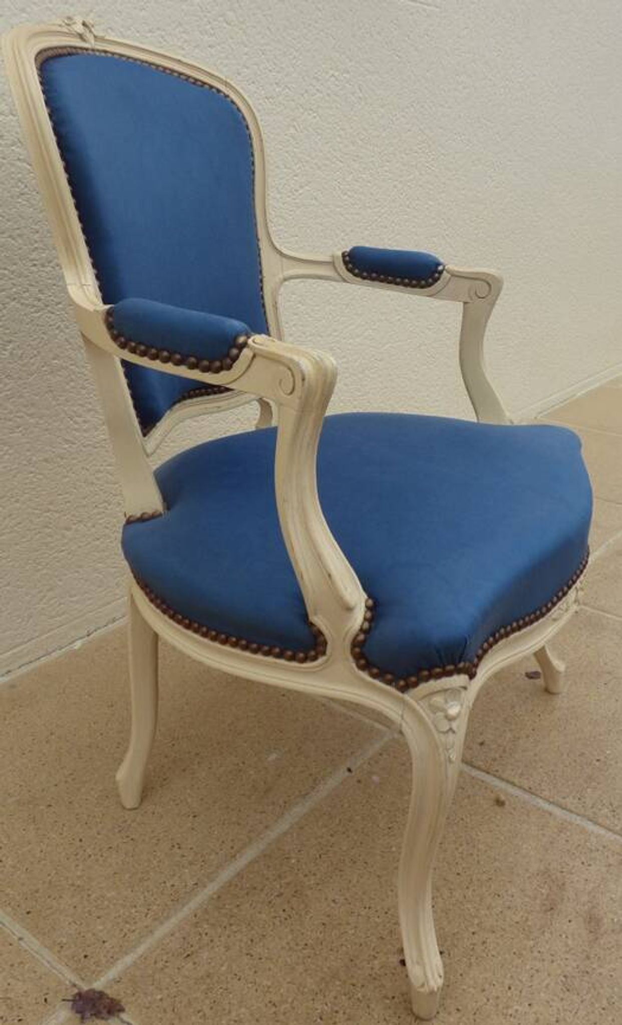 Cabriolet armchair in lacquered wood trimmed in blue satin, Louis XV style