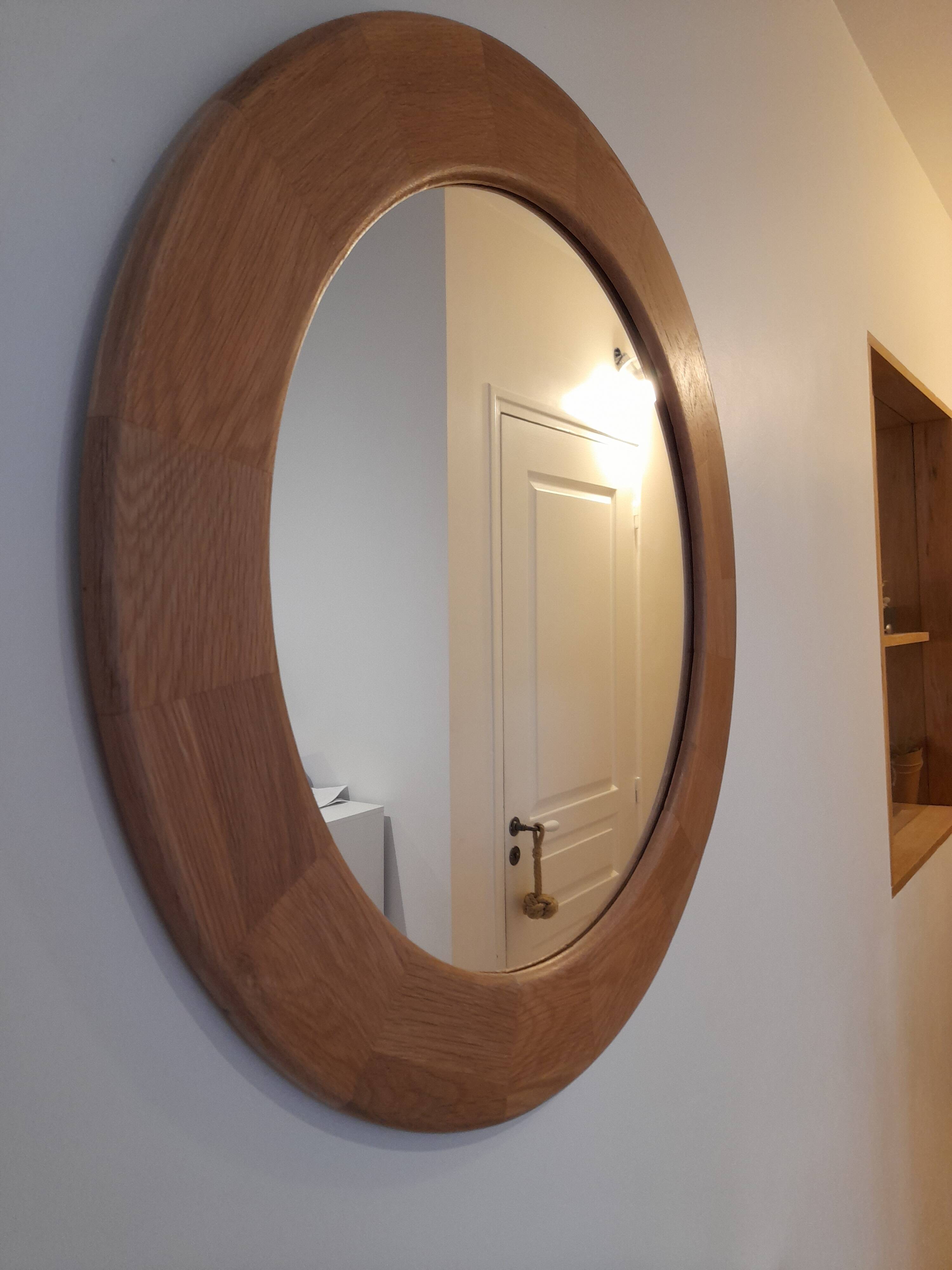 Round wall mirror made of solid wood