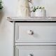 Commode ancienne à 4 tiroirs en bois peint gris perle patiné et pieds boules