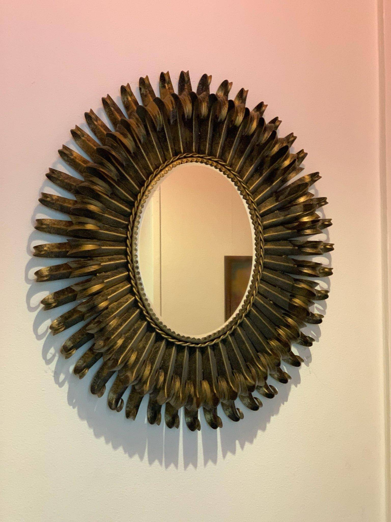 Golden iron star-shaped mirror, mid-1900s.