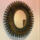 Golden iron star-shaped mirror, mid-1900s.