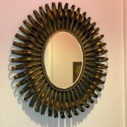 Golden iron star-shaped mirror, mid-1900s.