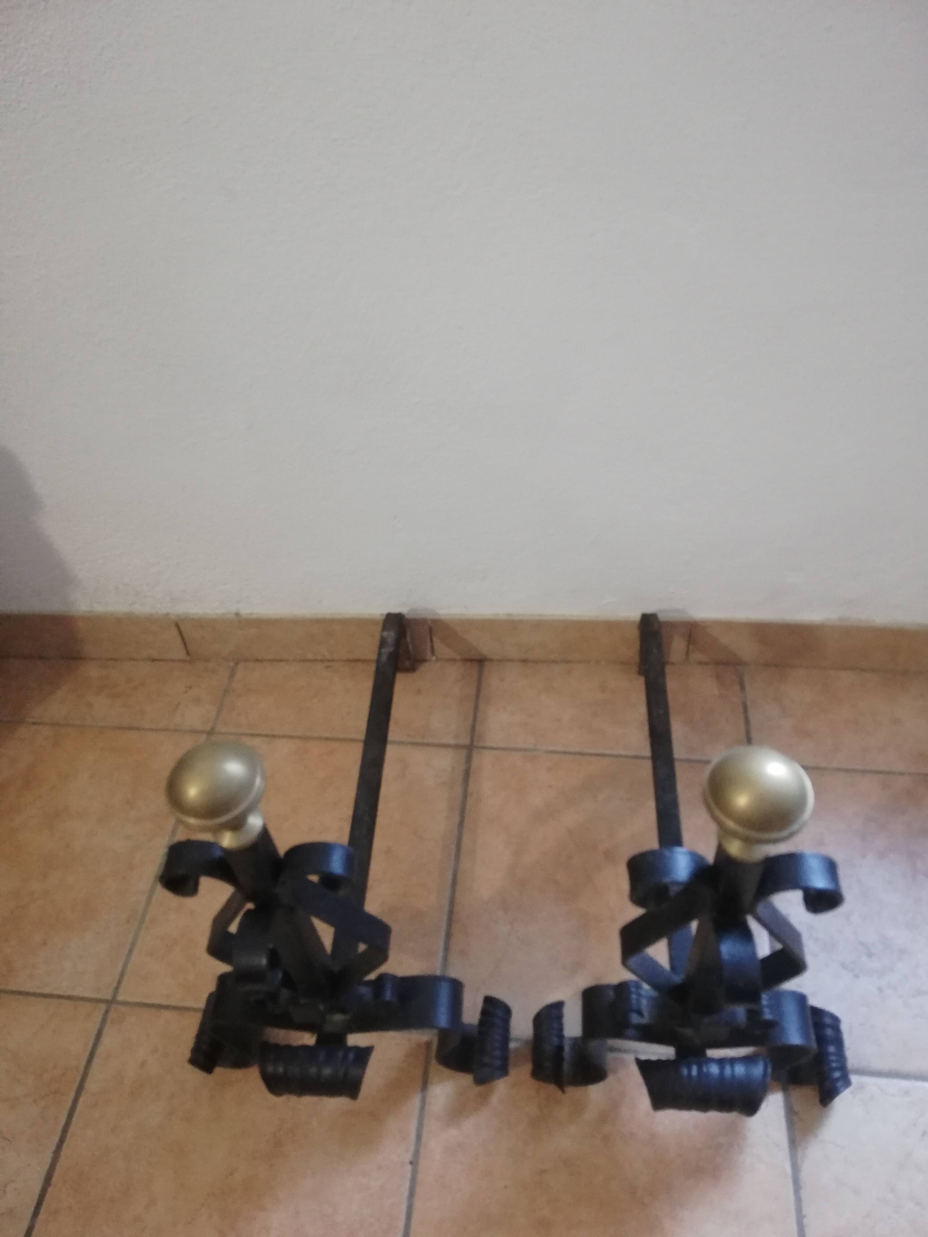 Pair of wrought iron andirons and brass ball.