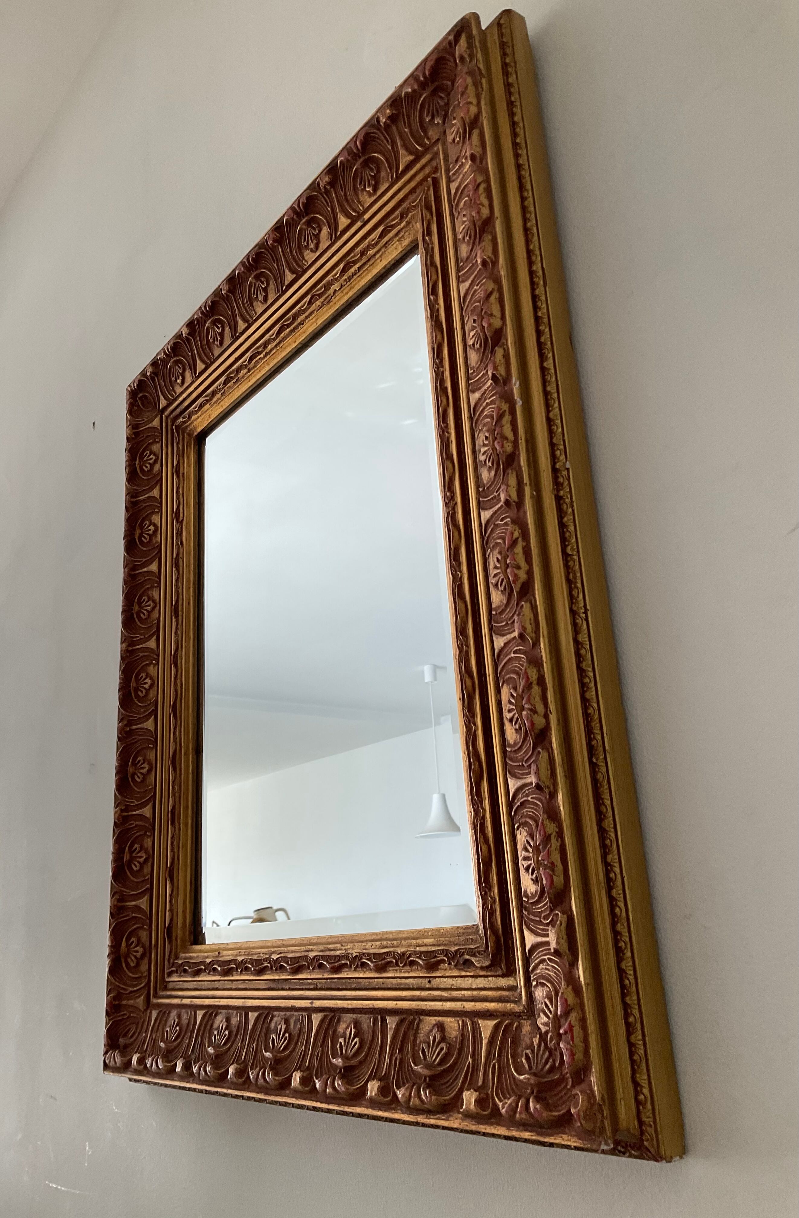 Old Beveled mirror in gilded wood