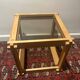 Table brutaliste en bois et verre fumé
