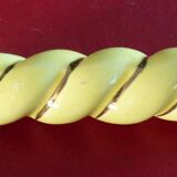 12 yellow and gold ceramic knife rests in their case from the 1950s.