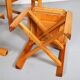 Set of 4 dining chairs in elm wood and cognac leather.