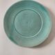 Earthenware bowl and saucer in glazed water green ceramic.