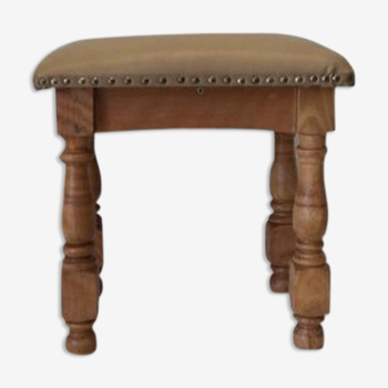 Rustic tabouret on leather