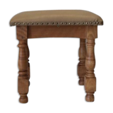 Rustic tabouret on leather
