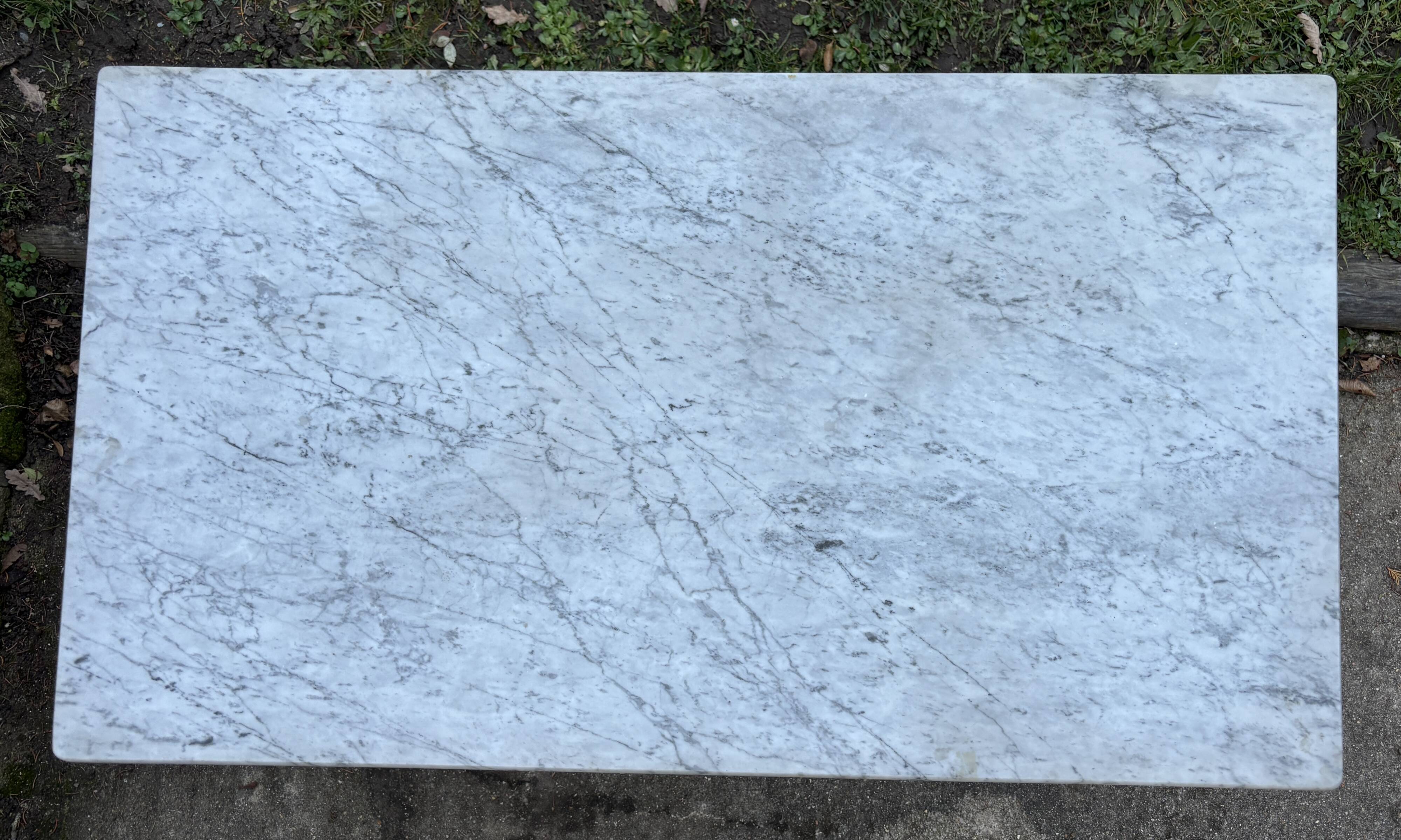 Old bistro table by Berc in Paris. Wrought iron, marble top.