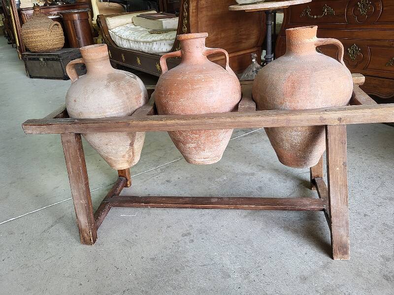 Old wooden jar holder with 3 clay jars