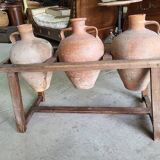 Old wooden jar holder with 3 clay jars