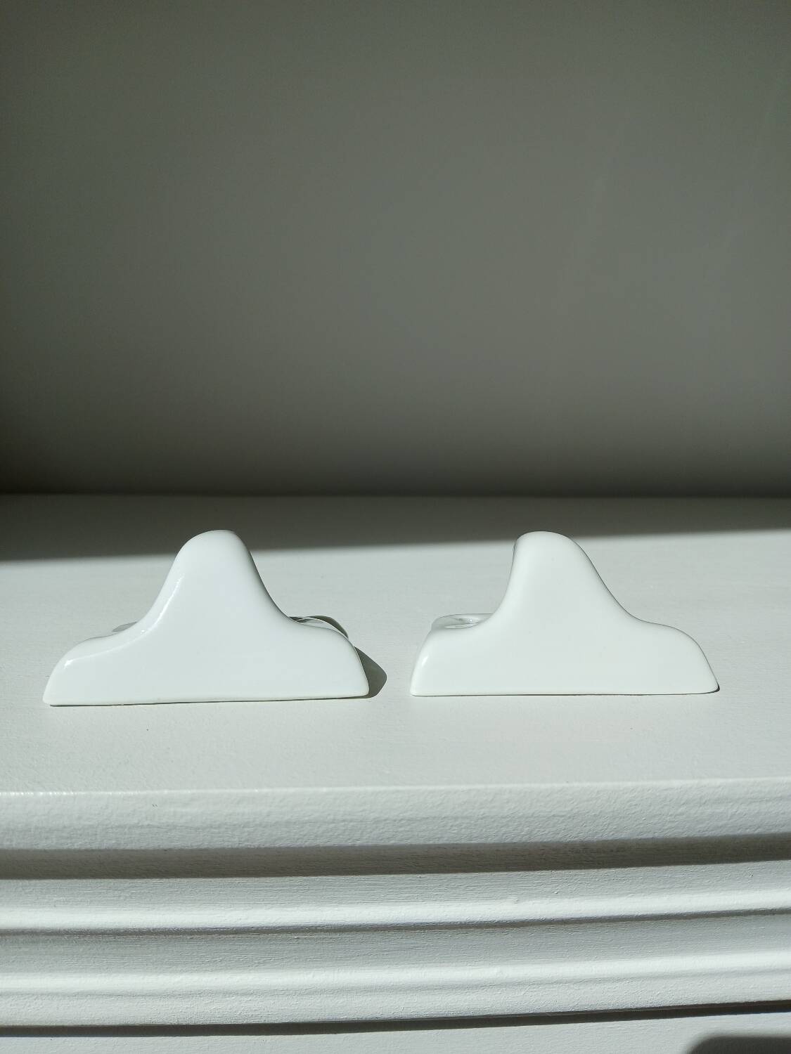 Set of two porcelain tea towel holders