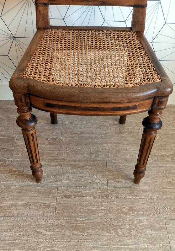 Solid oak art deco chair with cane and fabric.