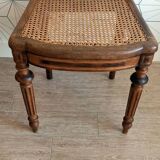 Solid oak art deco chair with cane and fabric.