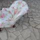 1950s vintage armchair in white and pink floral fabric, mahogany wooden legs.