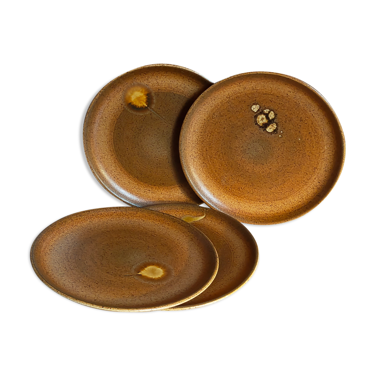 Four vintage glazed stoneware potter's plates