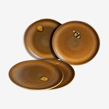 Four vintage glazed stoneware potter's plates