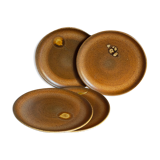Quatre assiettes de potier en grès émaillé vintages