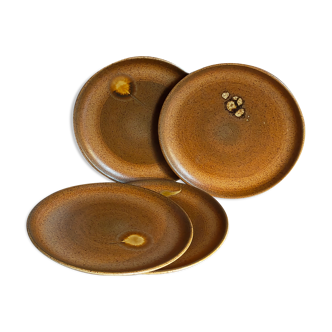 Four vintage glazed stoneware potter's plates